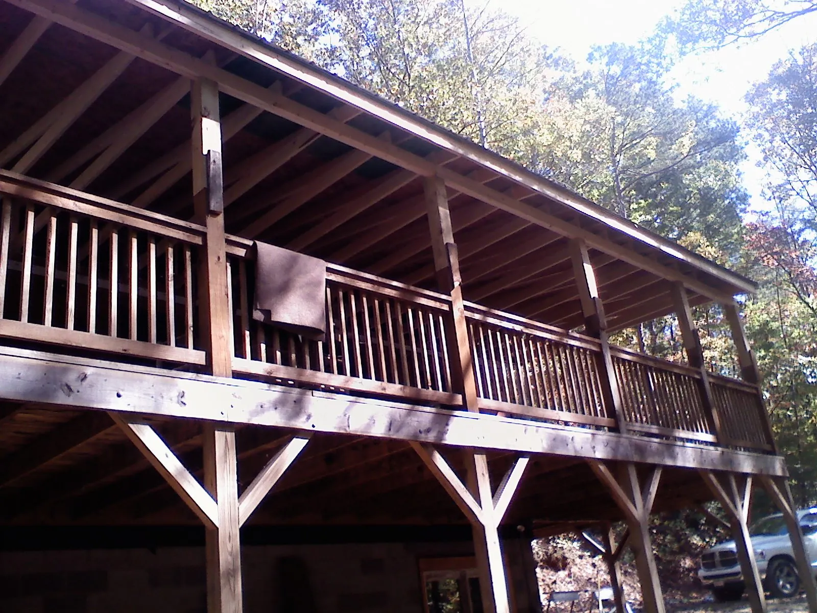 Timber framing under a new elevated porch and deck — Roof Leak Repair in Park City by Roofing Brothers
